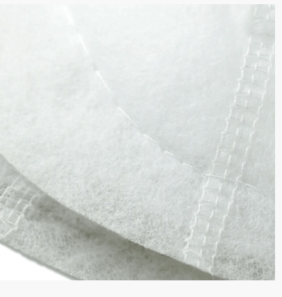 White polyester shoulder pads with a crescent raglan shape.