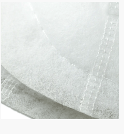 White polyester fleece raglan shoulder pads with visible stitching.