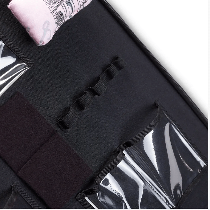 Black quilting organizer with clear pockets, elastic loops, and a pincushion.