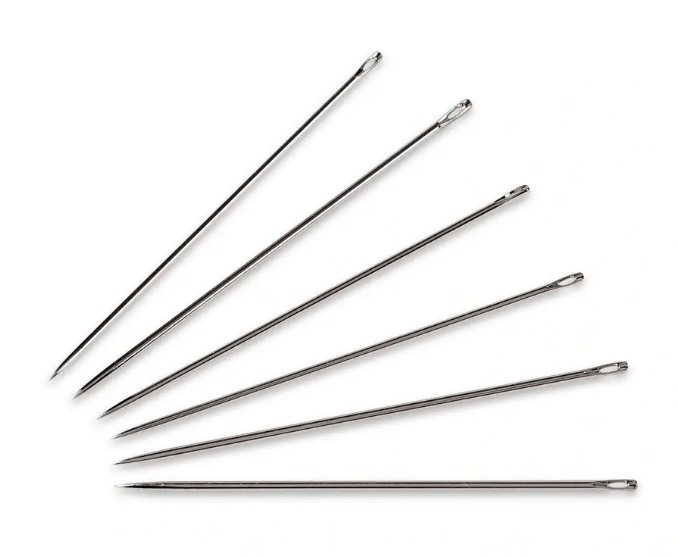 Six long steel sewing needles with silver eyes are fanned out on a white background.