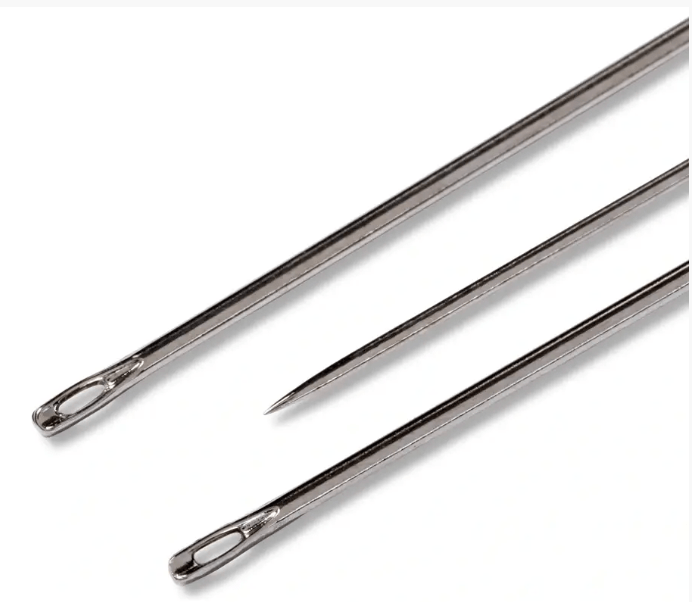 Three silver sewing needles of varying lengths on a white background.