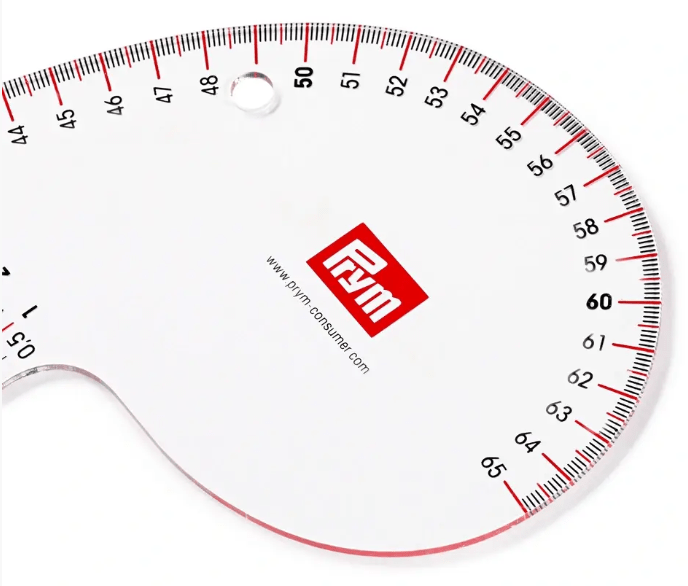 Transparent curved dressmaking ruler with measurements.