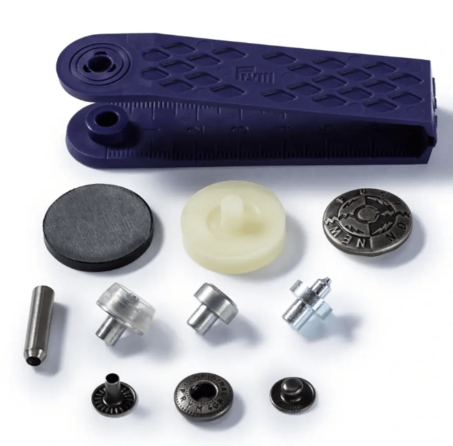 Antique silver brass non-sew press fasteners with tools.