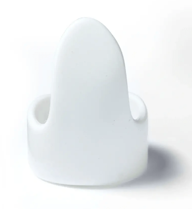 Adjustable white plastic quilter's finger guard.