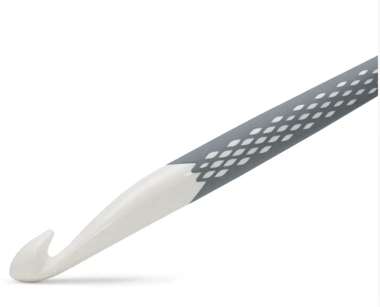 Prym Ergonomics crochet hook in grey with a white tip and patterned handle.
