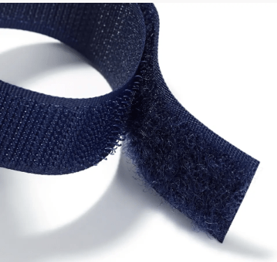 Blue adjustable arm pincushion with hook and loop strap.