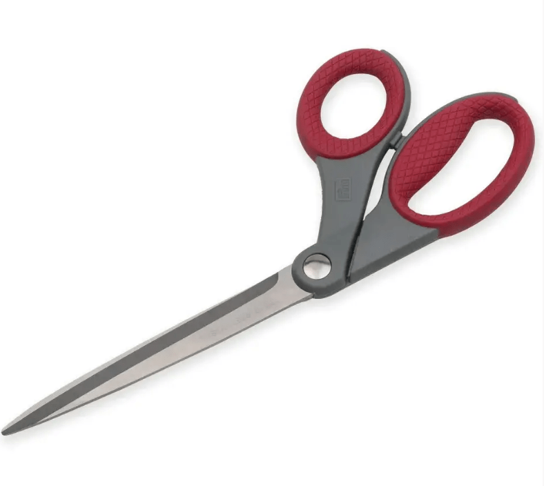 Dressmaking scissors with red plastic handles and asymmetric design.