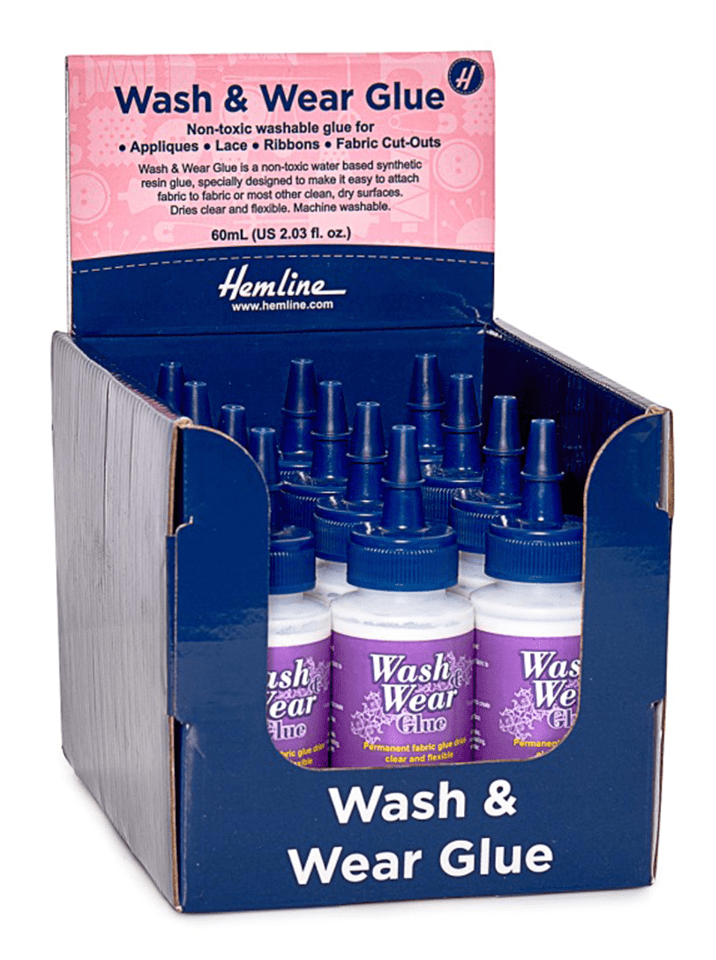 Display of 12 bottles of Hemline Wash & Wear fabric glue.