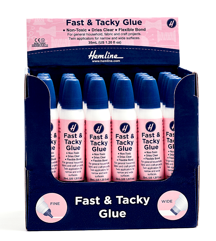 A display box of Hemline Fast & Tacky Glue bottles with twin applicators.
