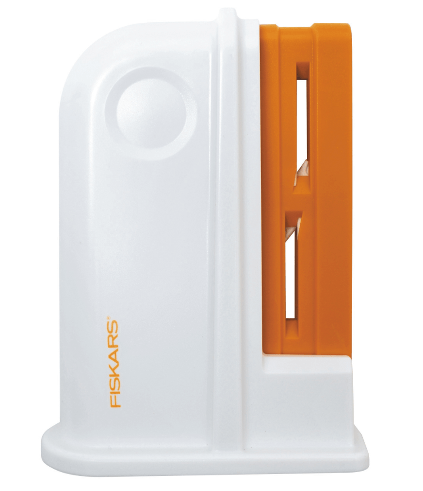Fiskars white and orange scissors sharpener with visible blades.