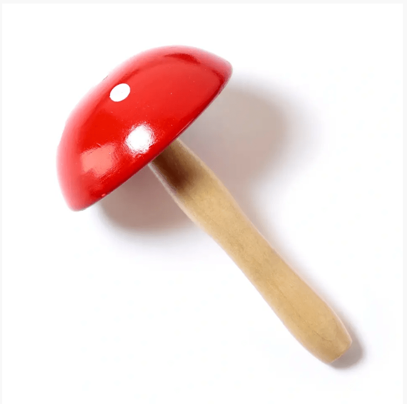 Wooden darning mushroom with a red cap and white dot.