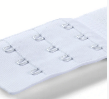 White bra extender with three rows of three hooks.
