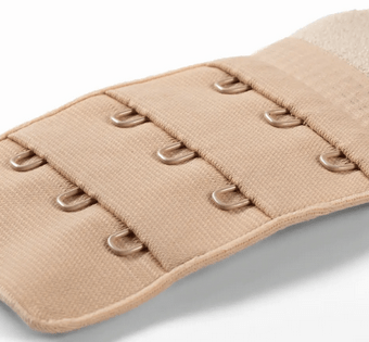 A beige bra extender with three rows of three hooks.
