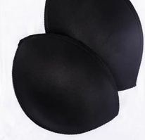 Two black push-up bra pads made of polyamide.