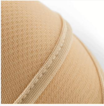 Skin-colored polyester bra cups with a mesh texture and a reinforced edge.