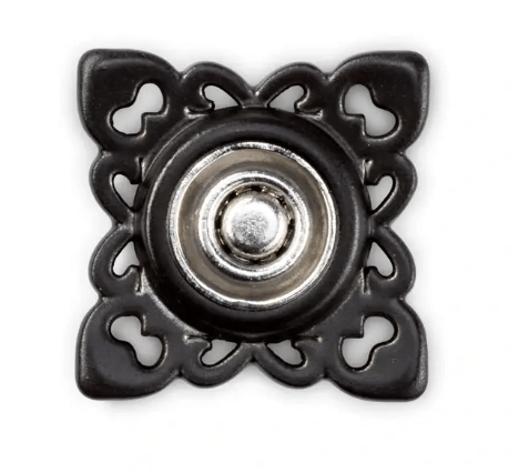 Square sew-on snap fastener with decorative metal frame.