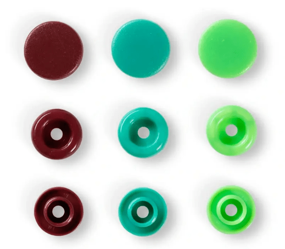 Assorted color plastic snap fasteners in three rows.