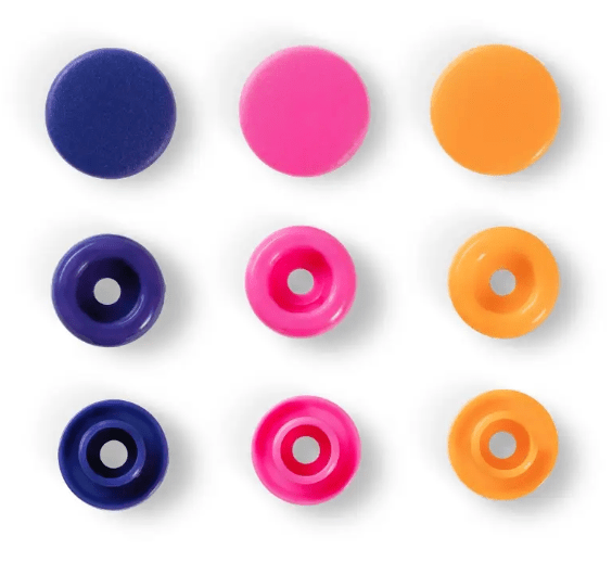 Nine assorted color plastic snap fasteners in blue, pink, and orange.
