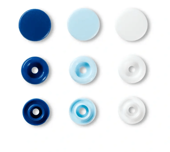 Assorted color plastic snap fasteners in three sizes and shades of blue and white.