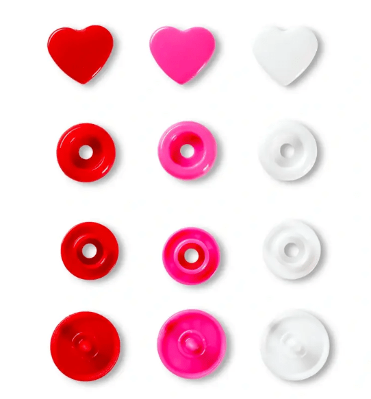 Assorted color plastic snap fasteners in heart and round shapes.
