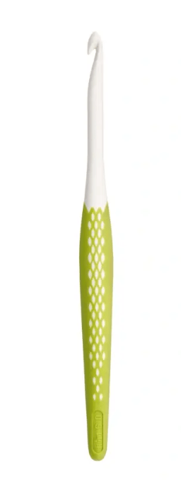A green and white ergonomic crochet hook with a textured grip.
