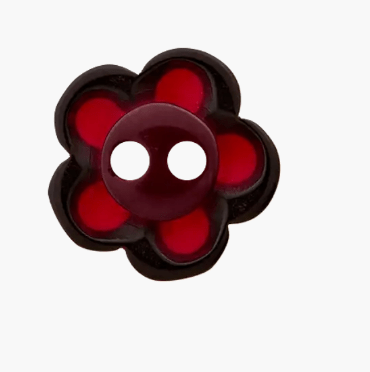 Red and black flower-shaped polyester button with two white holes.