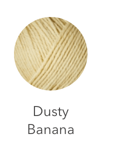 A ball of dusty banana colored heavy merino wool yarn.