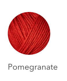A ball of Pomegranate red heavy merino wool yarn.