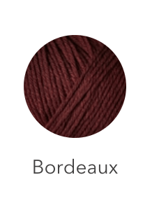 Bordeaux colored heavy merino wool yarn.