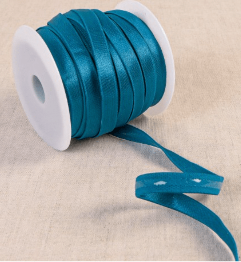 Coated elastic tape in teal, made of polyester, silicon, and spandex.