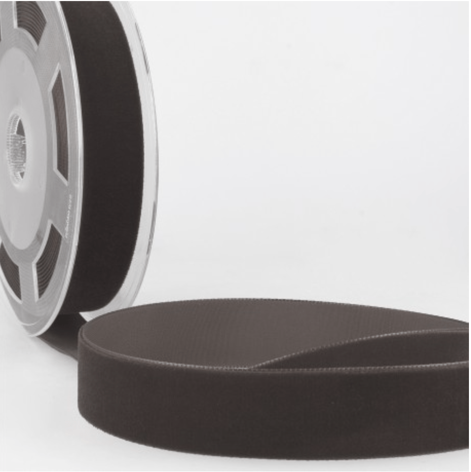 Velvet ribbon on a spool and a loose coil.