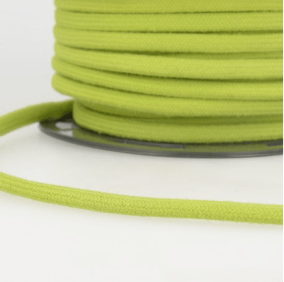 A spool of 4mm lime green 100% cotton craft cord.