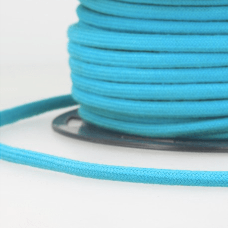 Turquoise 4mm cotton cord wound on a spool.