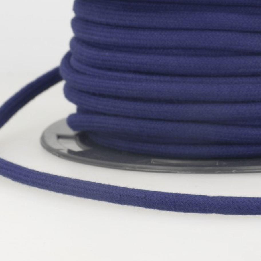 Dark blue 4mm cotton cord wound on a spool.