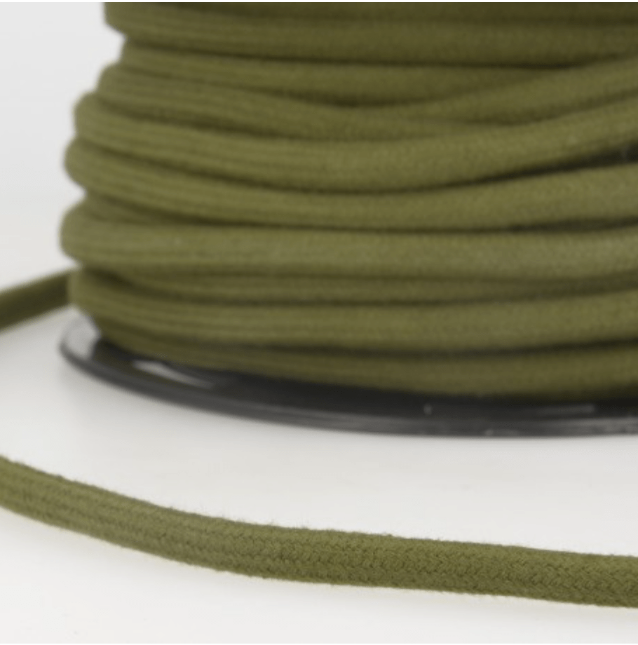 A spool of olive green 4mm cotton cord for crafts.