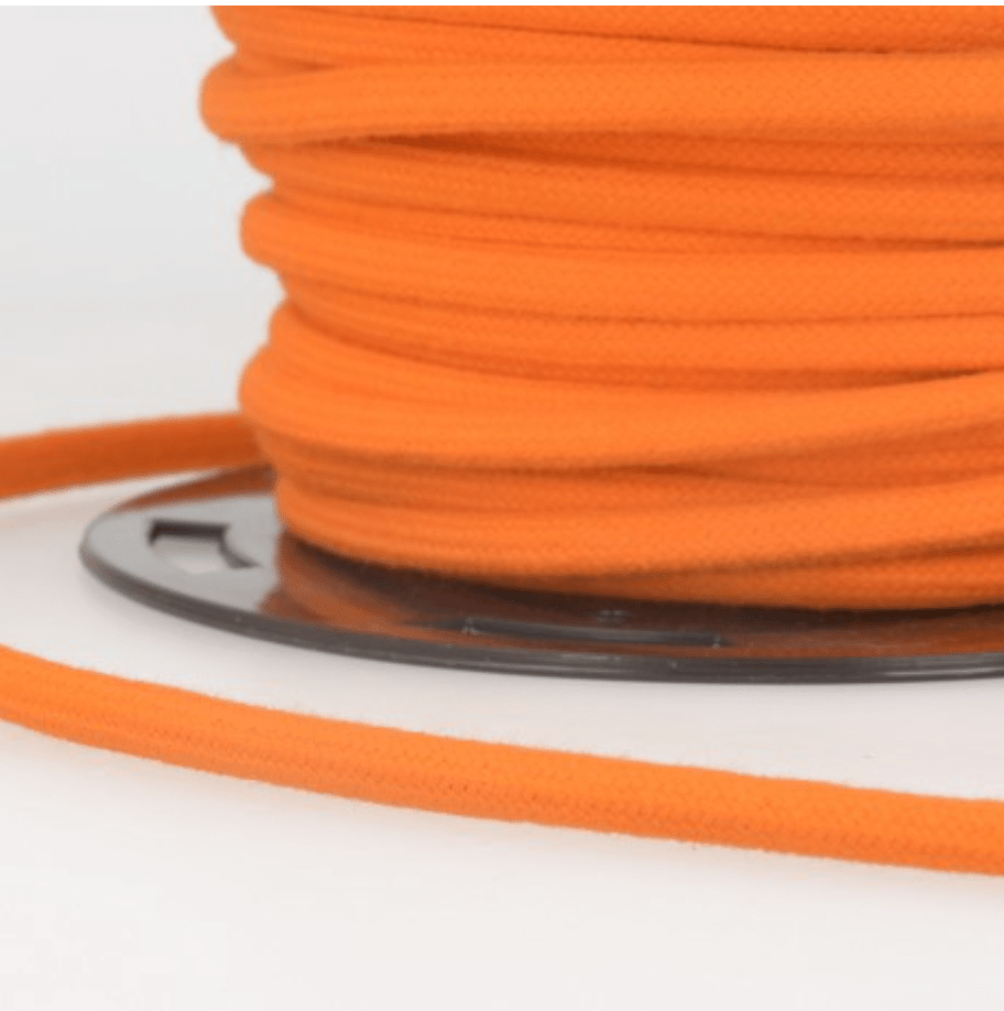 Orange 4mm cotton craft cord wound on a spool.