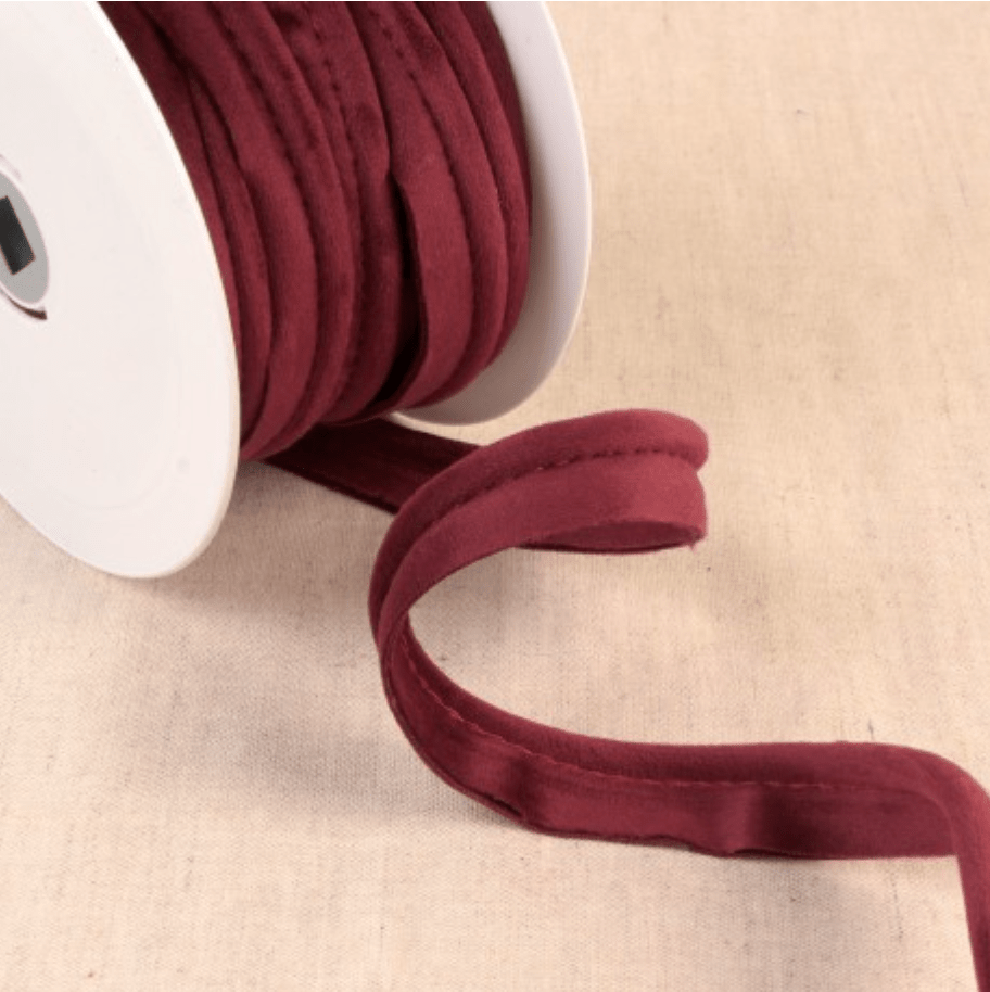 Stephanoise velvet piping cord in a deep red color.