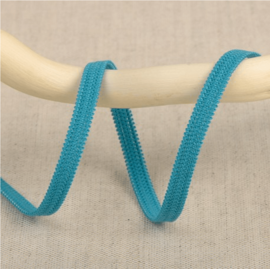 Turquoise elastic ribbon with a textured surface, 5mm wide.