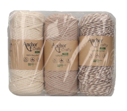 Three spools of Anchor Crafty Fine yarn in cream, beige, and speckled brown.