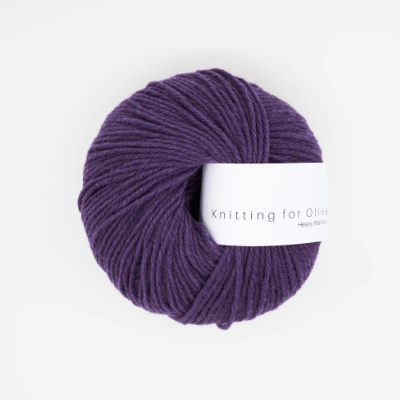 A ball of dark purple Heavy Merino wool yarn from Knitting For Olive.