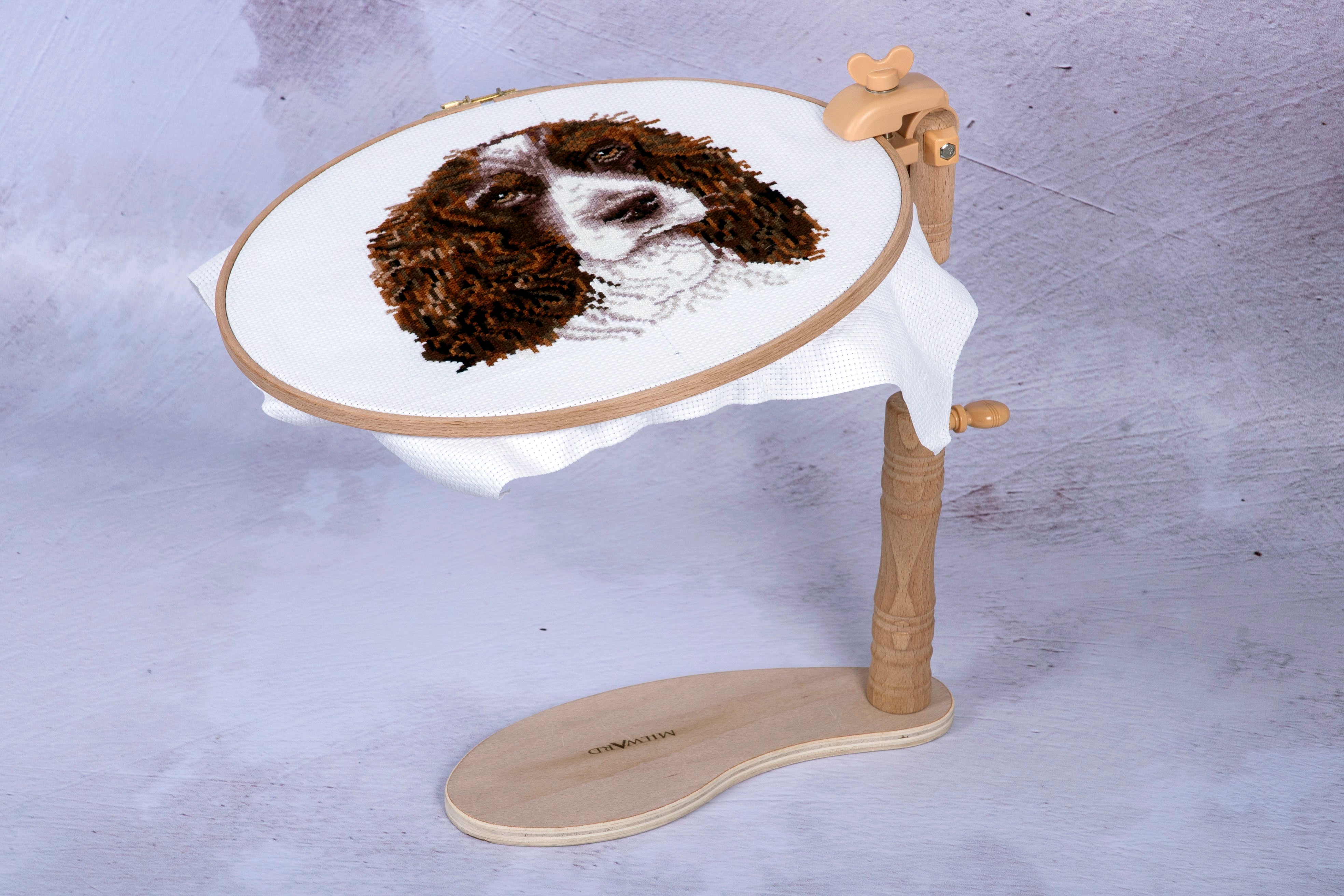 Milward beech wood seat frame with a versatile clamp holding an embroidery hoop with a dog design.