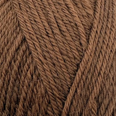 Close-up of Stylecraft Naturals Pure Wool DK yarn in a warm walnut brown shade.