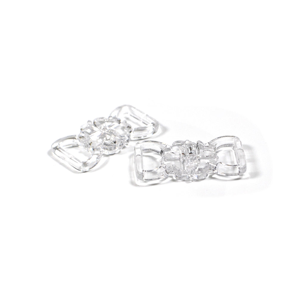 Two clear floral nylon clasps on a white background.