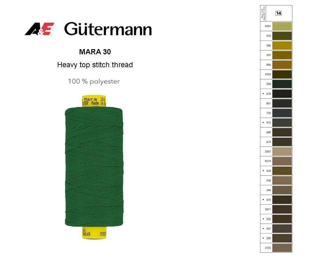 A spool of green Gutermann Mara 30 heavy top stitch thread next to a numbered color shade card.