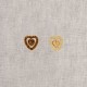 Two heart-shaped alloy craft buttons with rhinestones.