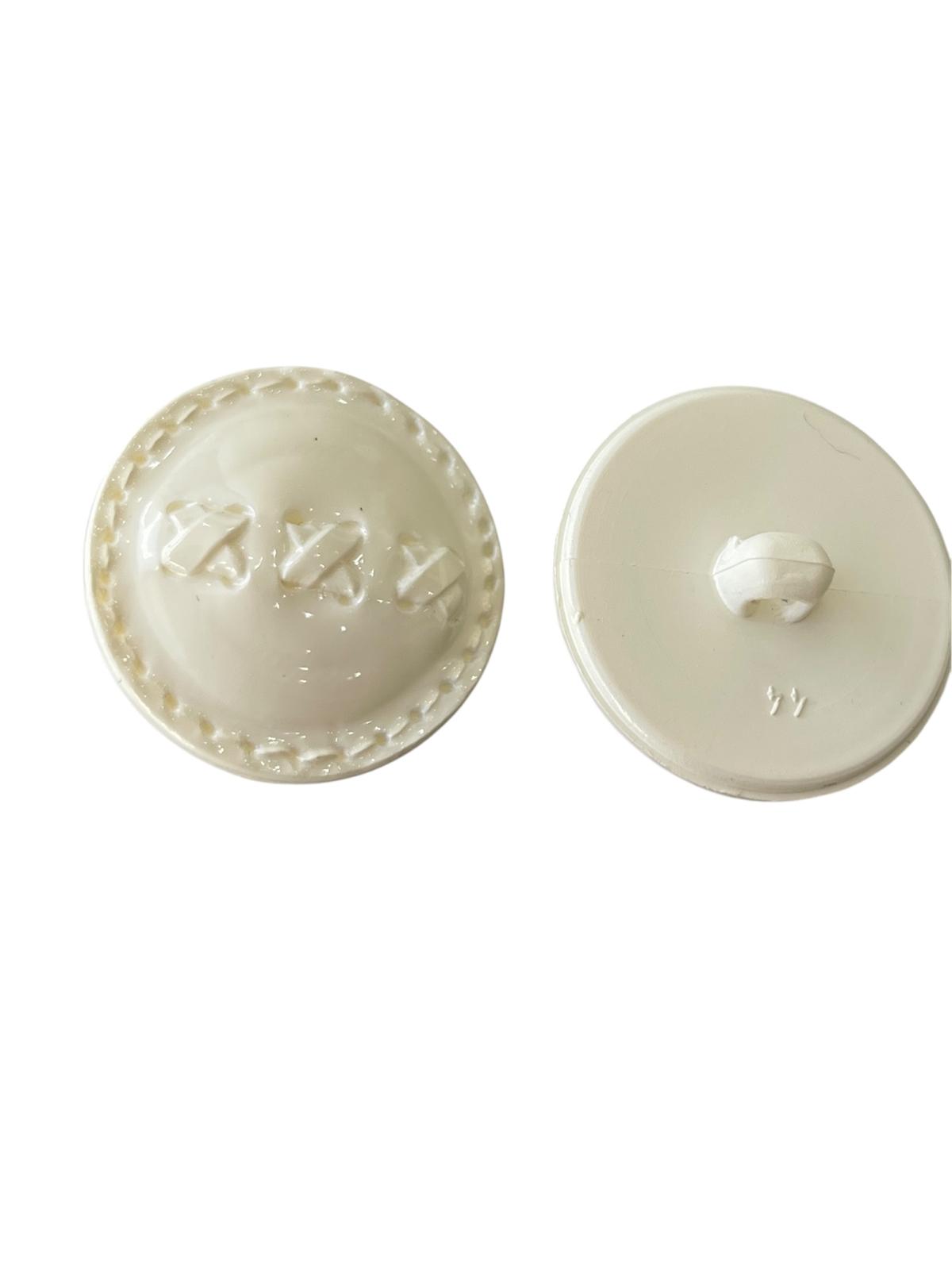 Front and back view of a cream 30mm polyester shank button with a patterned dome design.