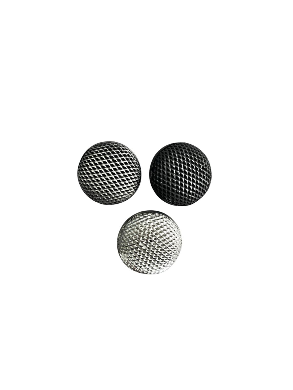 Three round metal dome shank buttons with a textured diamond pattern in silver, gunmetal, and black.
