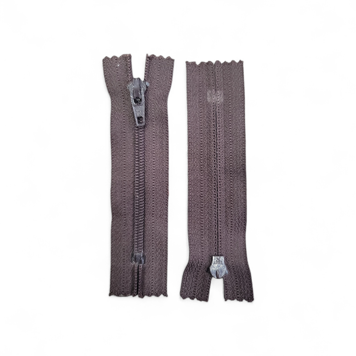 Two grey 8cm closed-end plastic zippers with metal pull tabs.