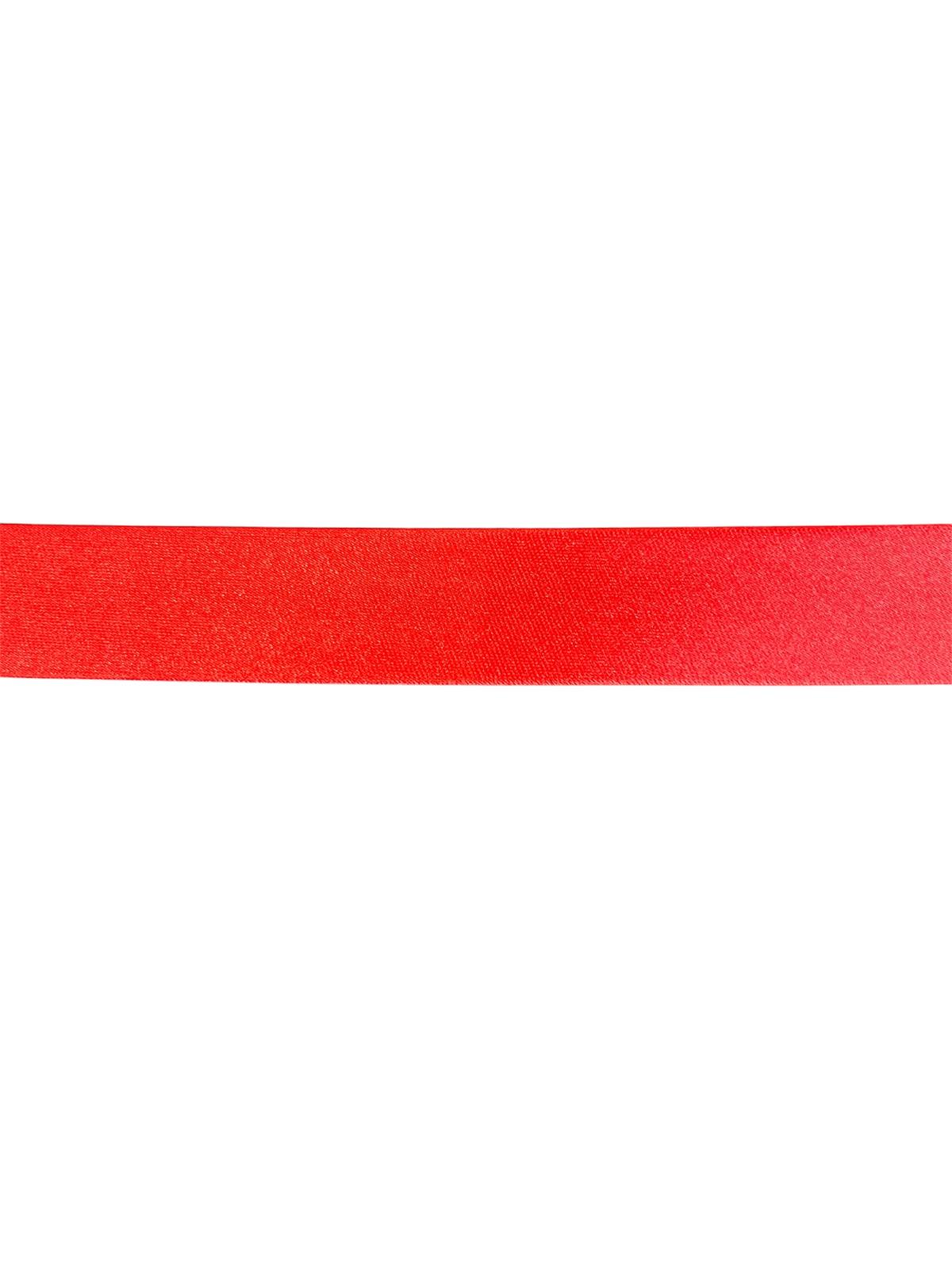 Close-up of a vibrant red satin bias binding tape for sewing and crafting.