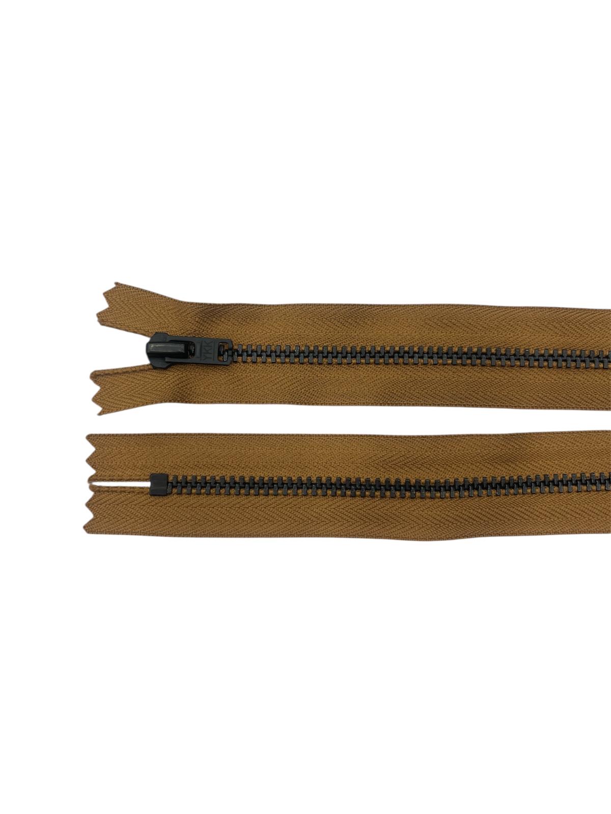 Two brown zippers with black metal teeth and sliders on a white background.